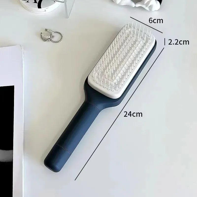 Dark blue hairbrush with white bristles, 24cm long, ideal for detangling and scalp massage