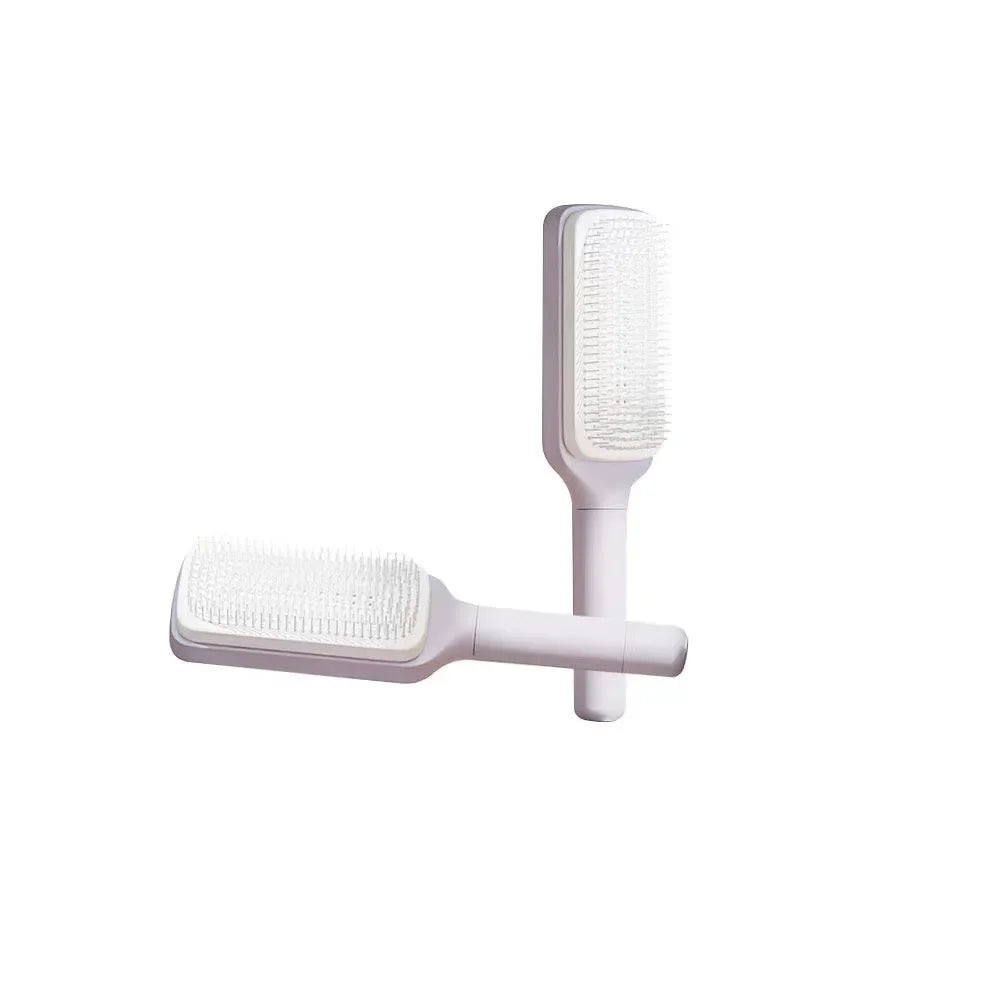 White detangling hair brush with soft bristles, ergonomic handle for easy grooming