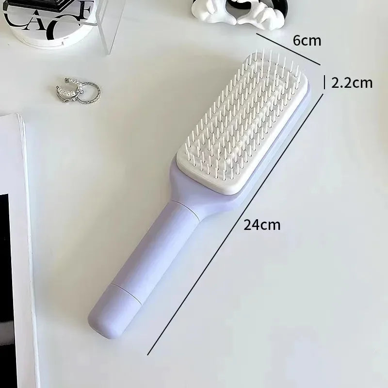 Purple hairbrush with white bristles, 24cm long, ideal for gentle detangling and scalp massage